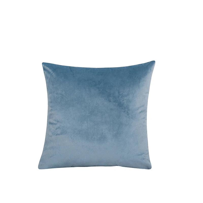 Blue velvet pillow on a white background