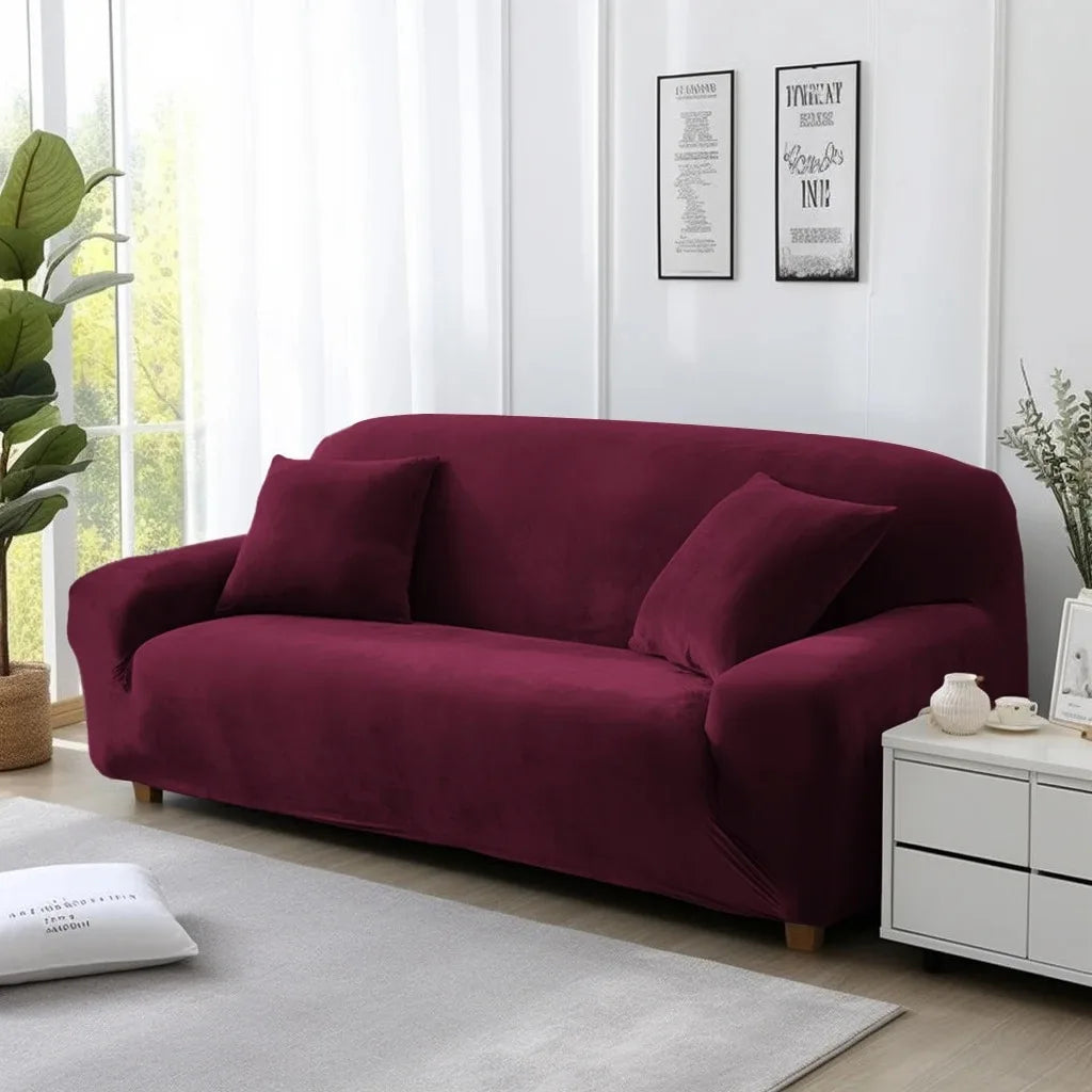 Wine red cover on lounge in a living room with white walls and decor