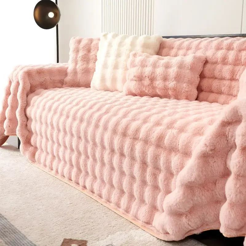 Pink plush faux rabbit bubble sofa cover on a couch in a room with a light-colored floor.