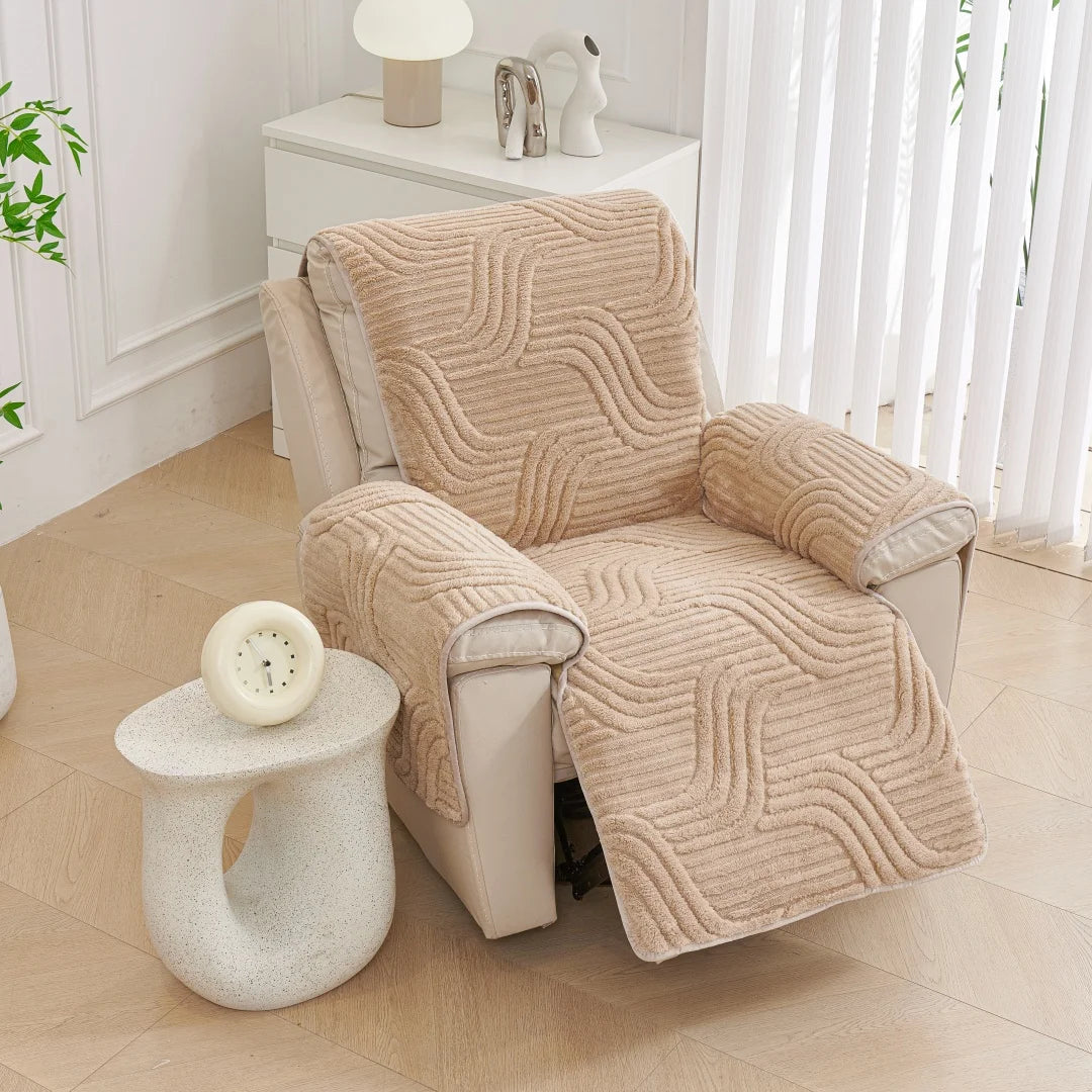 Beige textured armchair cover on a chair in a bright room with a side table.