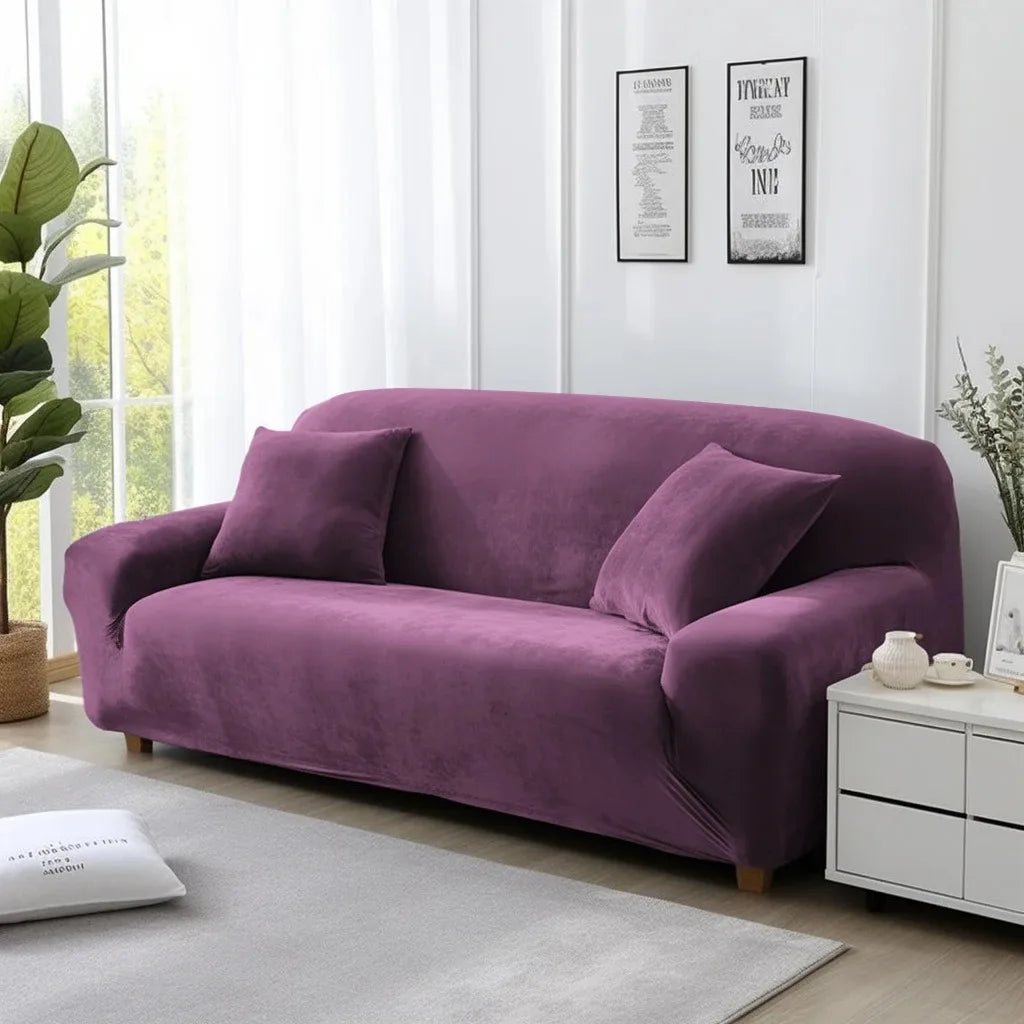 Purple sofa cover on lounge in a living room with white walls and decor