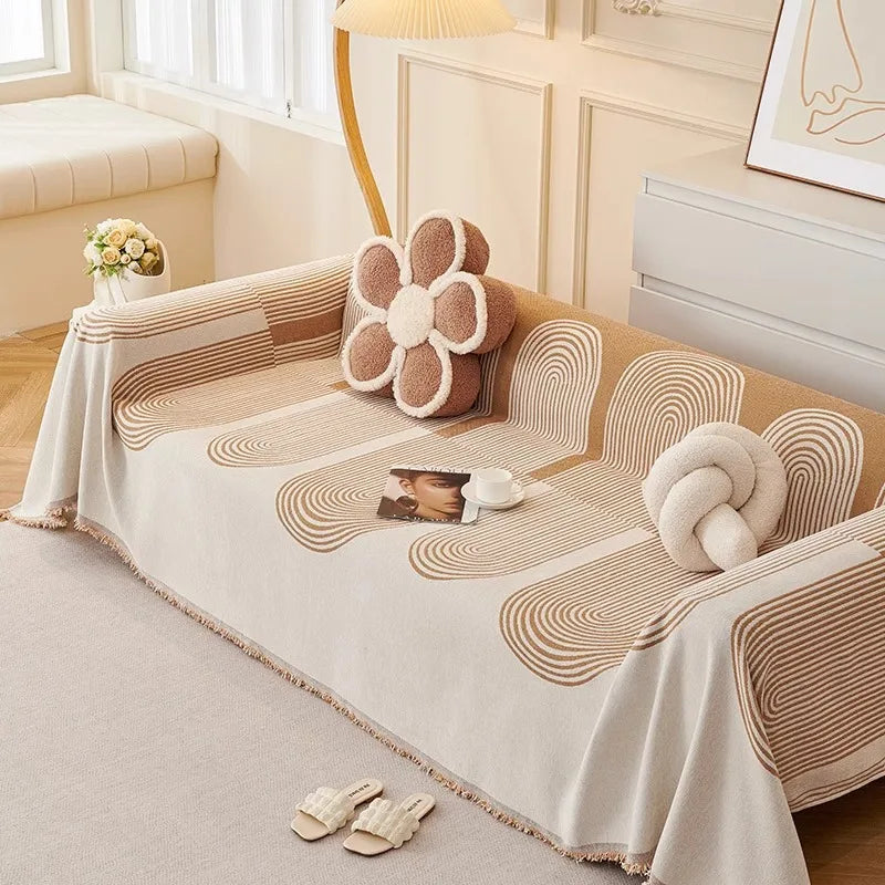 Decorative bedspread with circular patterns on a bed in a bedroom setting.