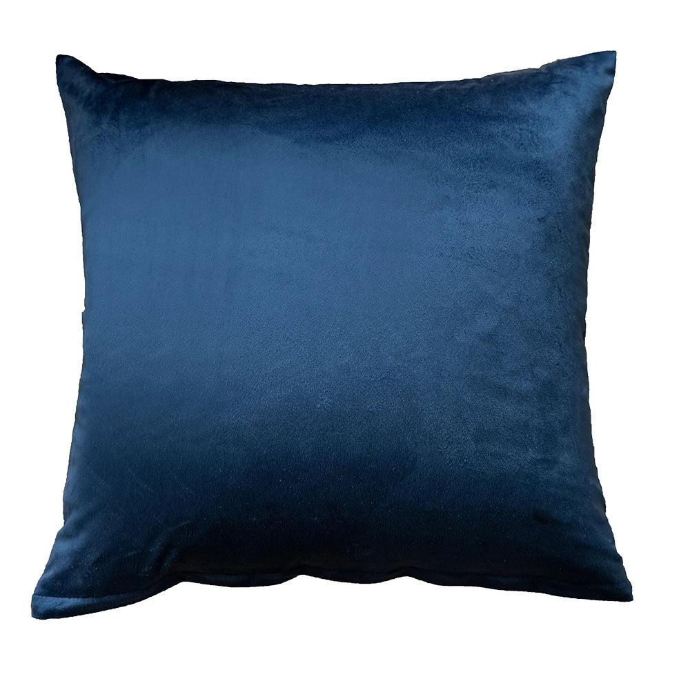 Blue velvet pillow on a white background