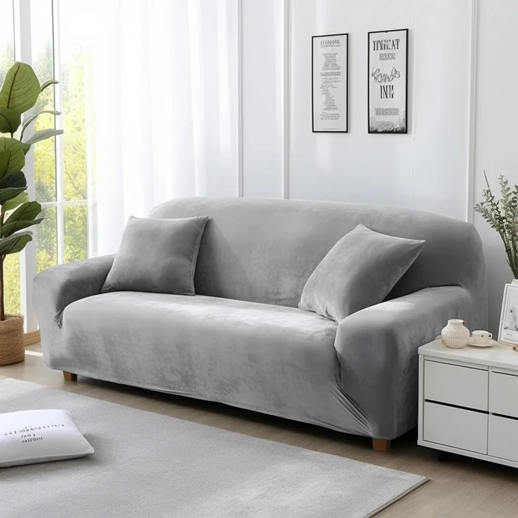 Silver grey sofa cover on lounge in a living room with white walls and decor