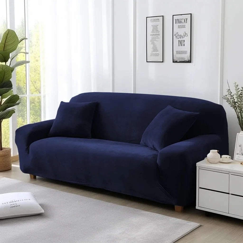 Navy blue cover on lounge in a living room with white walls and decor