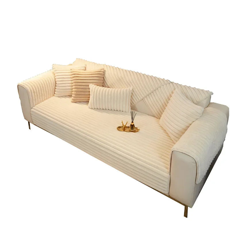 Beige sofa with decorative pillows on a white background