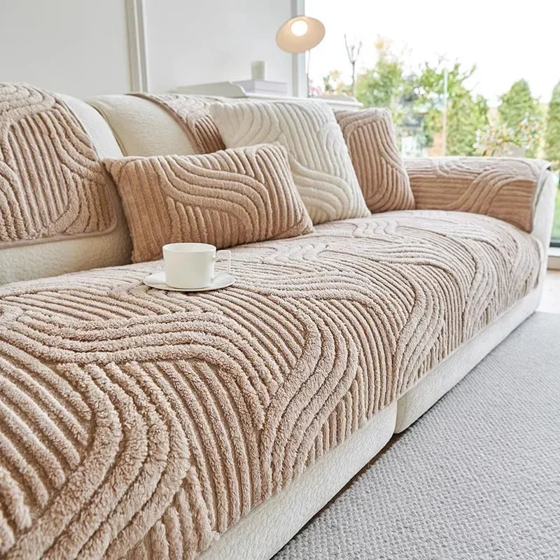 Beige textured sofa cover with matching cushions in a modern living room.