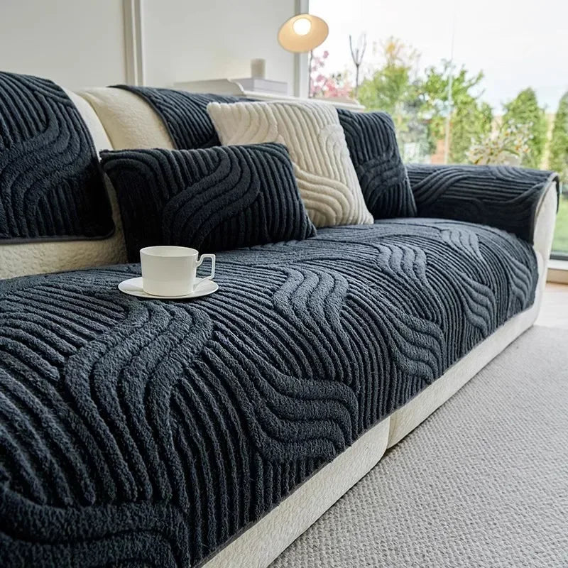 Dark grey textured sofa cover with a cup of coffee on a white surface