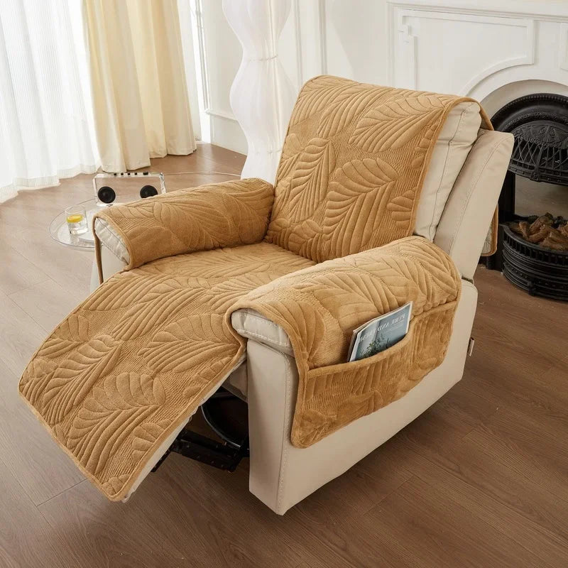 Beige recliner chair with a matching cover in a living room setting.