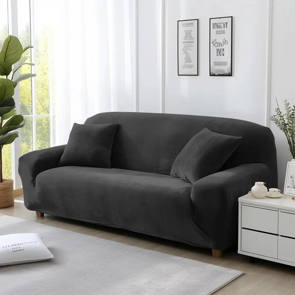 Grey sofa cover on lounge in a living room with white walls and decor