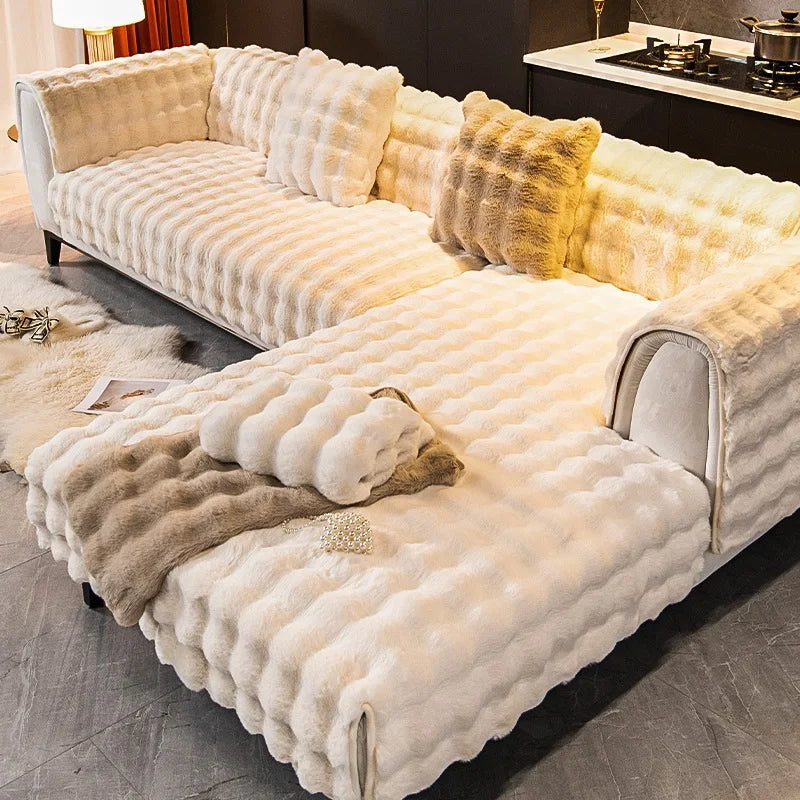 Fluffy white sofa with decorative pillows in a living room setting.