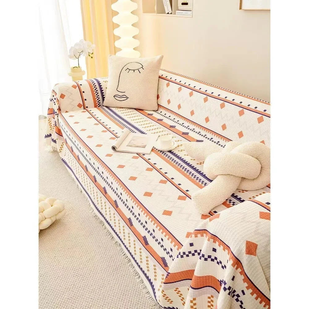 Decorative sofa with patterned cover and cushions in a cozy room.