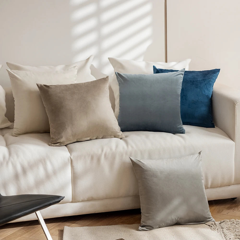 Beige sofa with decorative pillows in various colors