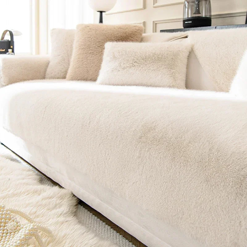 White sofa with fluffy cushions in a living room setting