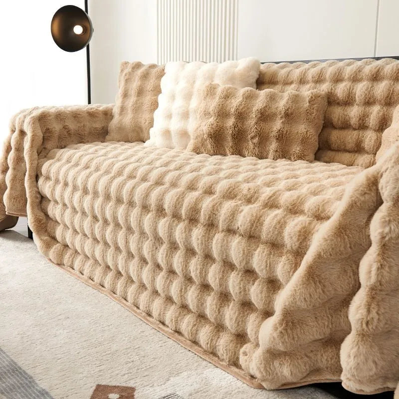 Beige textured sofa cover on a couch in a living room setting