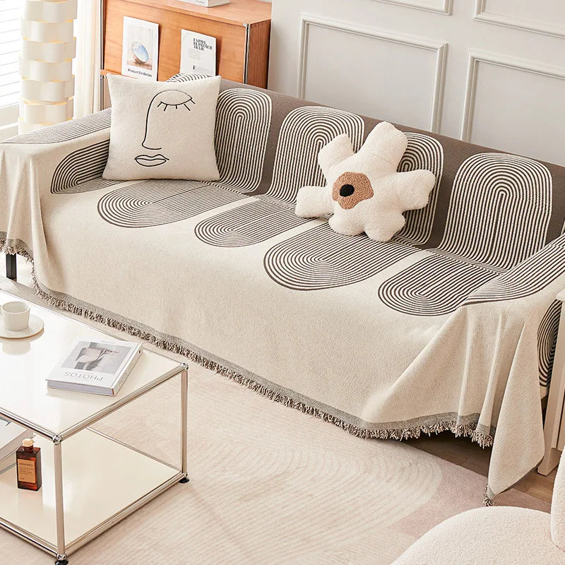 Sofa with a decorative cover and plush toy in a living room setting